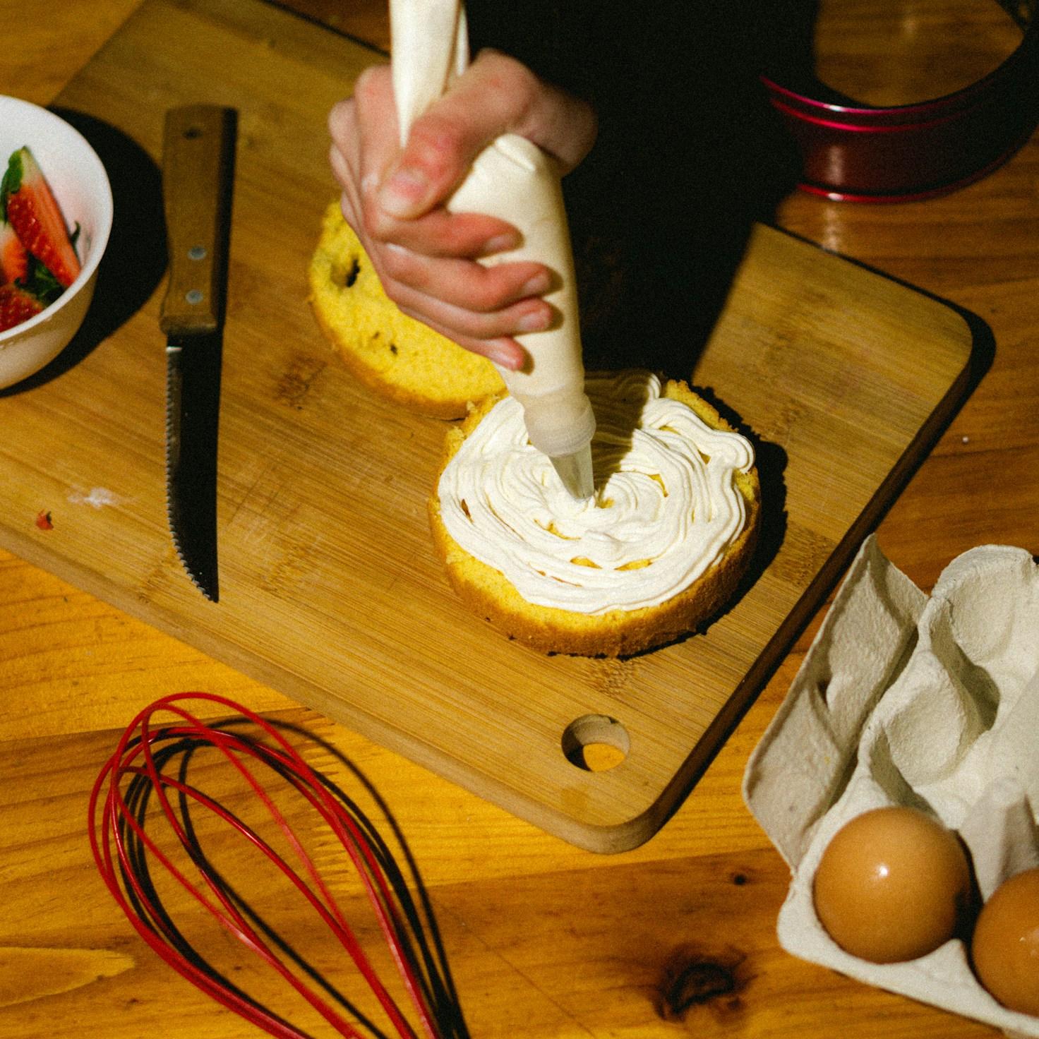 Community members collaborating in a contemporary kitchen, exchanging recipes and techniques